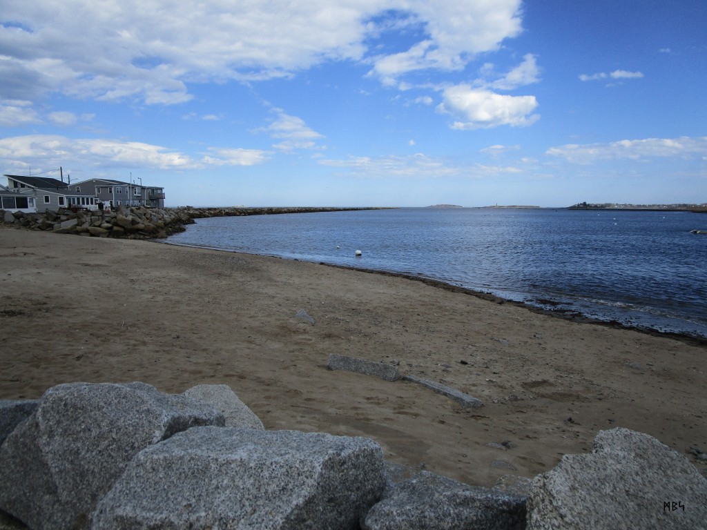 Looking out the mouth of the Saco River in Maine from the Camp Ellis pier with the North Jetty on the left. Photo by Mike Smetzer.