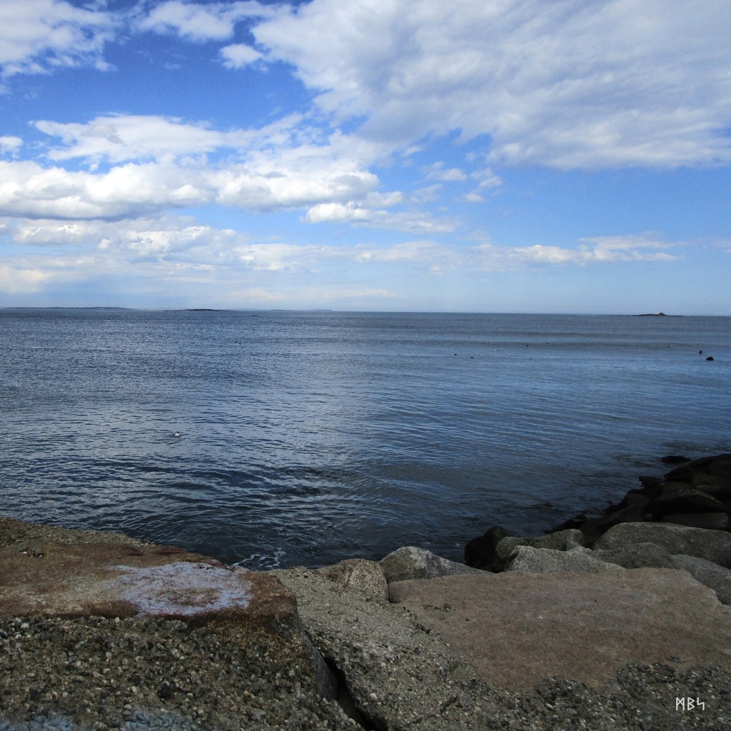 Looking out to sea from the start of the North Jetty in Camp Ellis, Maine. Photo by Mike Smetzer.